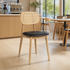 Relish Side Chair Natural Cane Back with Black Faux Seat Pad in a light cafe setting