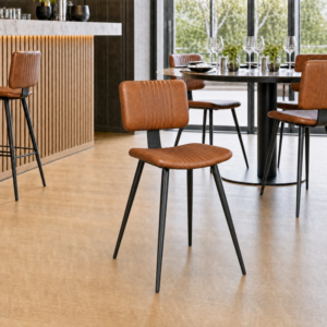 Sebastian Leather Side Chair – Genuine Bruciato Leather in a light restaurant setting