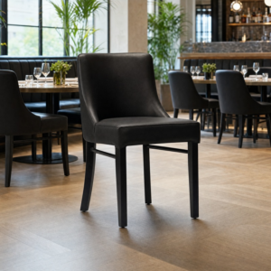 Camden Black Faux Leather Restaurant Dining Chair Black Frame in restaurant setting
